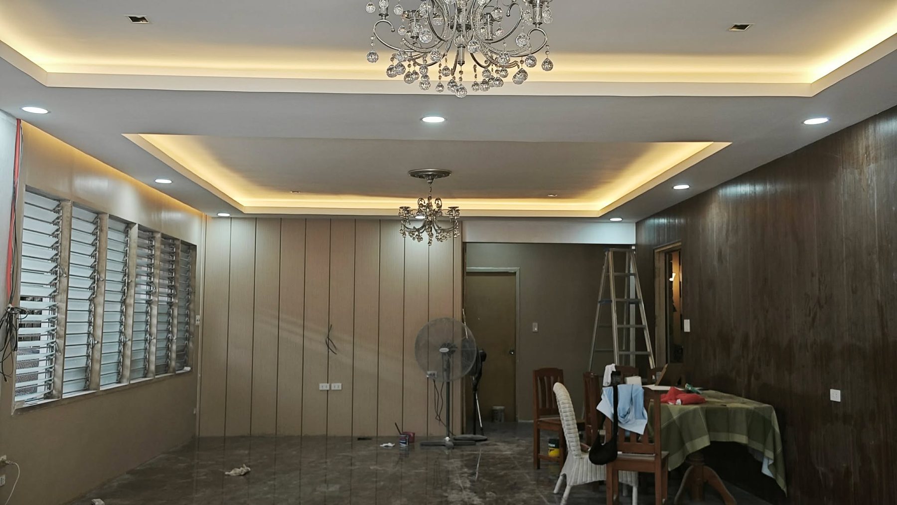 Wide view of renovated residential living and dining space