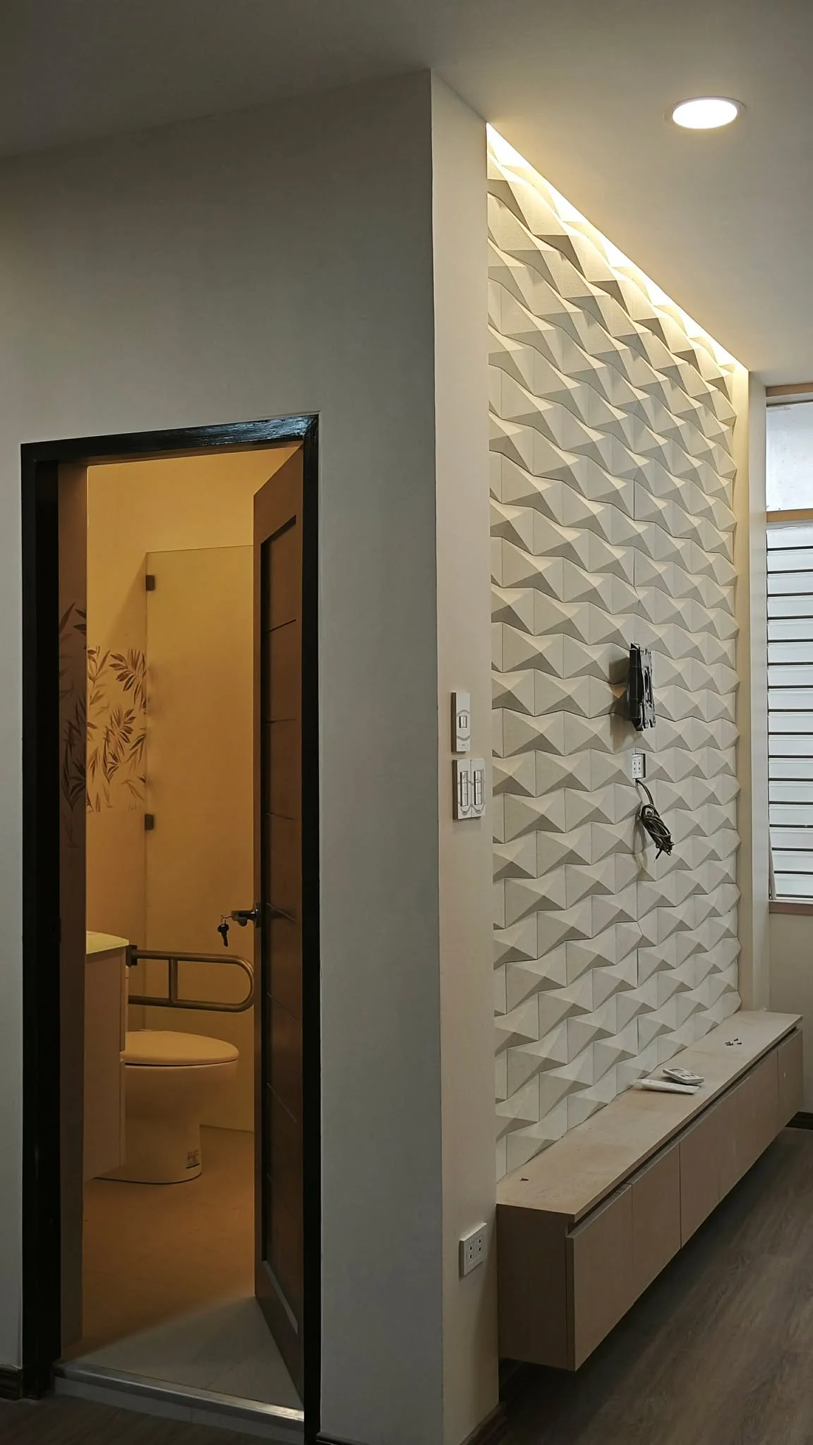 Interior feature wall with textured finish and integrated lighting