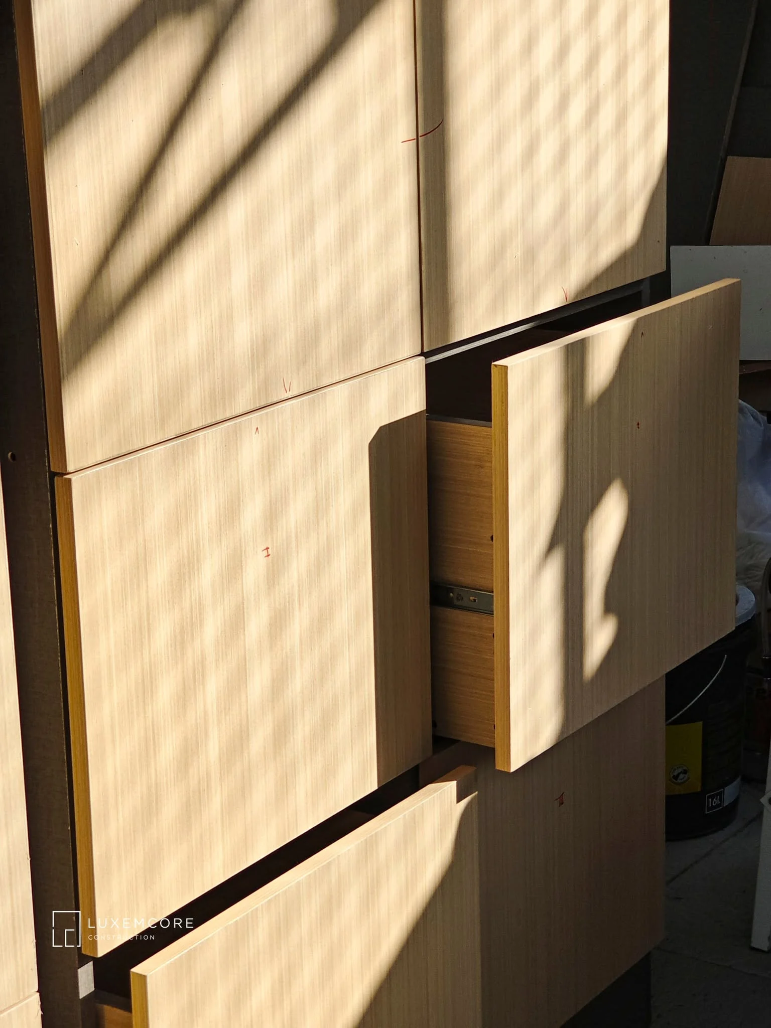 Custom cabinetry craftsmanship with wood-finish panels and drawer detailing