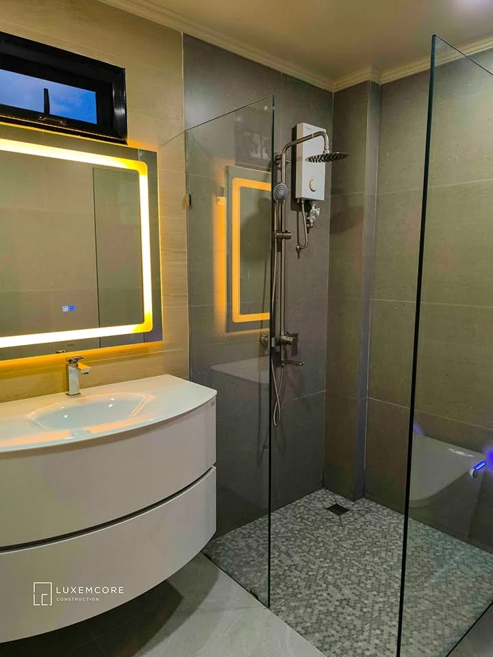 Toilet and bath shower enclosure, vanity and fixture finishing detail